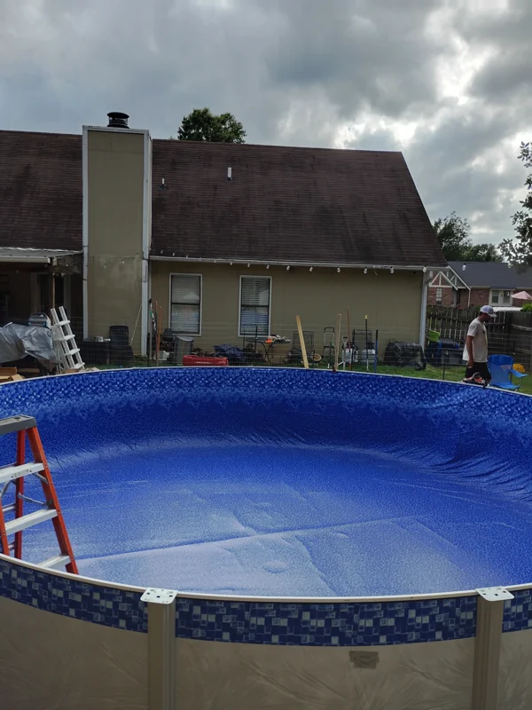 Above-ground pool with a new liner holding water