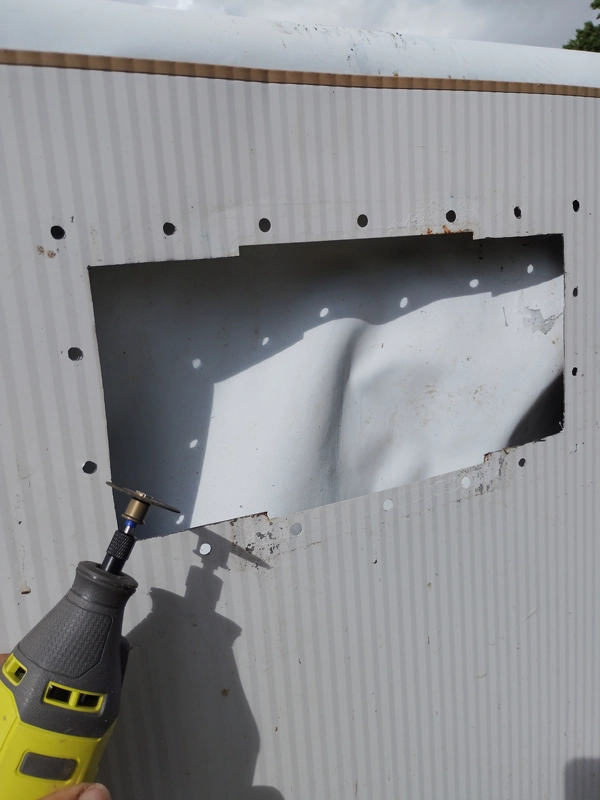 New skimmer opening cut into an above-ground pool wall