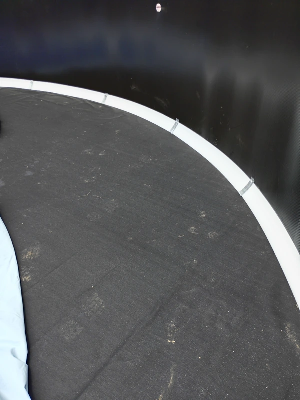 Above-ground pool wall and track ready for a new liner