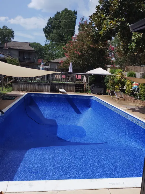 New blue vinyl liner in a rectangular inground pool